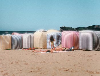 Dreamin’ / This photo was taken while I was walking on the beach. I saw this little girl, trying to catch something, I could not say what, but there she was, in the middle of beach tents. She seemed to be free, avoiding her parent's supersvision.