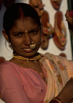 Rajasthan / Of the many jewels an Indian woman displays around her body, the nose ornament (nath) is perhaps one of the most eye-catching.

The bindi, or forehead jewel, is placed on the area which is believed to house the agya chakra, or third eye. 

These examples of Indian facial jewellery complement the earrings and necklace beautifully.

Photo by Michel Guntern, https://TravelNotes.org