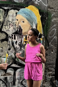 Girl with a perl / Girl in San Paolo, Brazil in front of graffiti