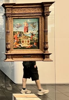 Masterpiece / A man walking past an old master’s piece displayed on a glass wall in Săo Paolo Museum of Art, Brazil