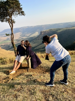Photographer / A photographer taking pictures of a couple in the natural setting