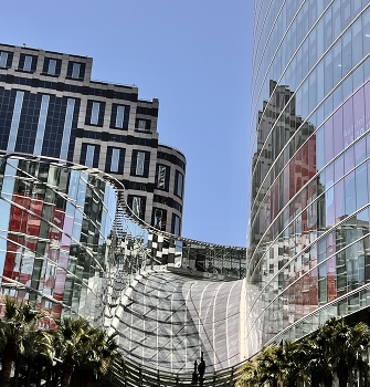 Reflexions / Modern city architecture designed with interconnections between buildings in mind