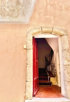 Red Door / The door open wide into an old building