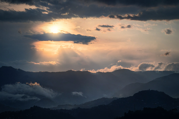 Sun In Clouds / Rays of sunshine from behind the clouds