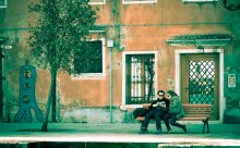 Involved / Couple reading book in the street, Venice