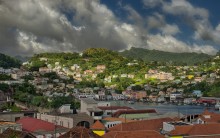 The Carenage, St.George's, Grenada / St. George's is the capital of Grenada. The city is surrounded by a hillside of an old volcano crater and is on a horseshoe-shaped harbor.