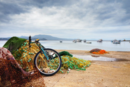 &nbsp; / Koroni. Fishing nets and abandoned bicycle on seafront. Messinia, Greece