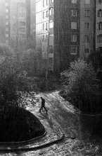 Walking under the rain / street photo from Lwow