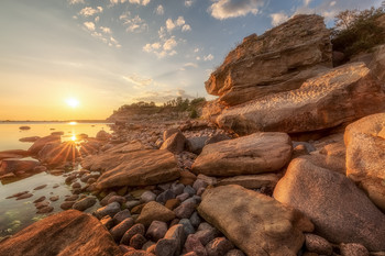 Sunset / Limestone rocks in the shoreline along the Baltic sea coast, Estonia