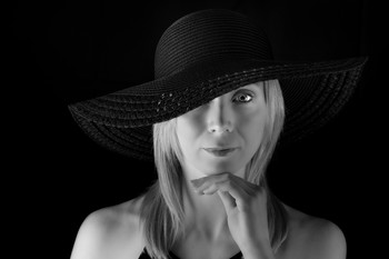 Millie portrait / Black and white portrait shot of Millie modeling a wide brimmed black hat.