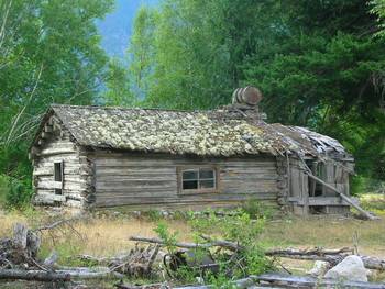 Tweedsmuir Provincial Park / settlers cabin home on highway #20 near Tweedsmuir Park on route to Bella Coola BC Canada