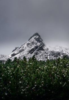 Lonely peak / Another beautiful sunset in the mountains. First snow and beautiful sunset made a great scenery to remember