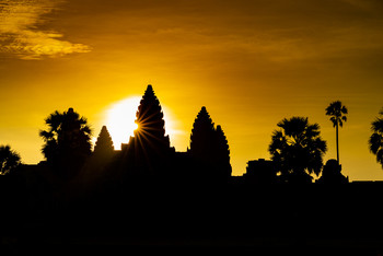 Silhouette of Angkor Wat with sunrise in the morning / Silhouette ancient temple complex Angkor Wat with morning Sunrise, wonderful orange sky, Siem Reap Cambodia